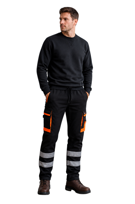 Man wearing a black fleece work trousers with orange accents on a white background